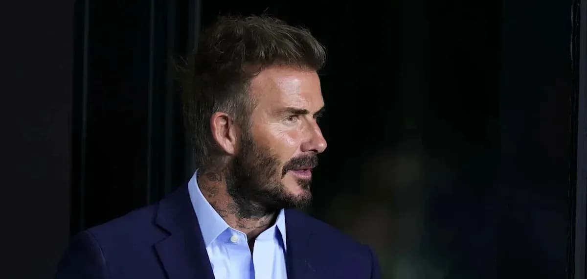 Man with short hair and beard in a suit