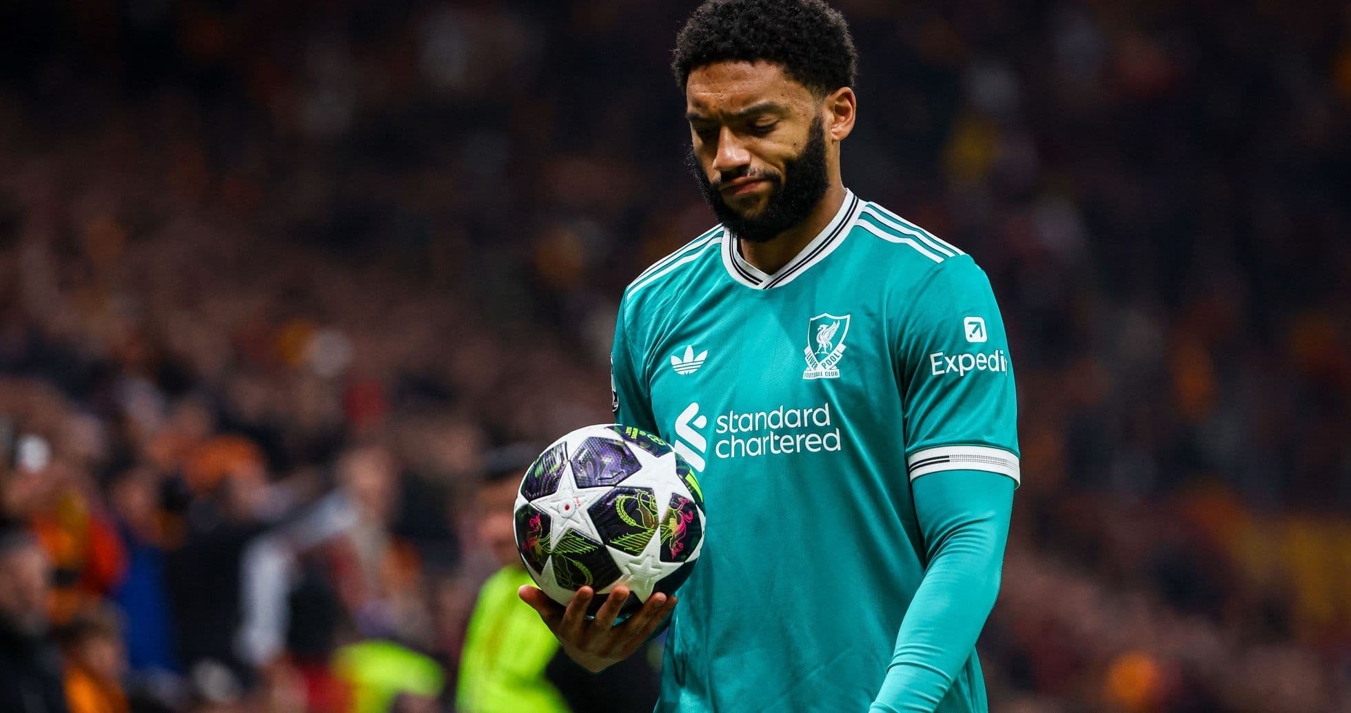 Player holding a football during a match