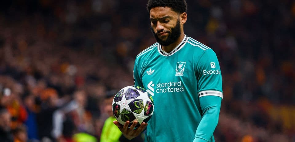 Player holding a football during a match