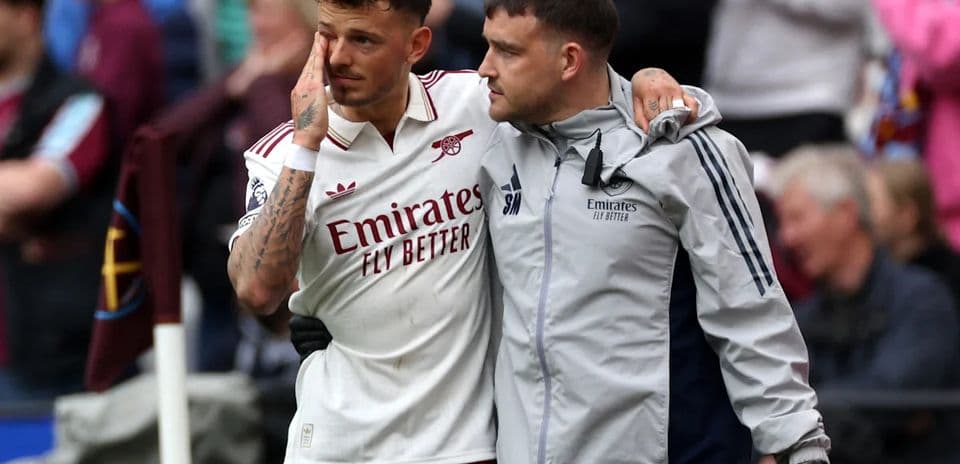 Player receiving support from staff after leaving pitch
