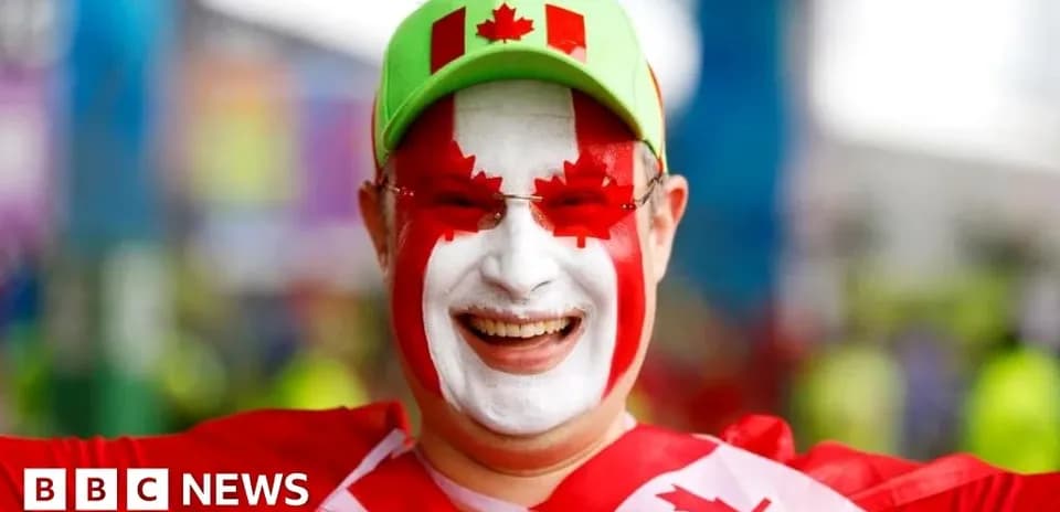 Fan with Canadian flag face paint celebrating