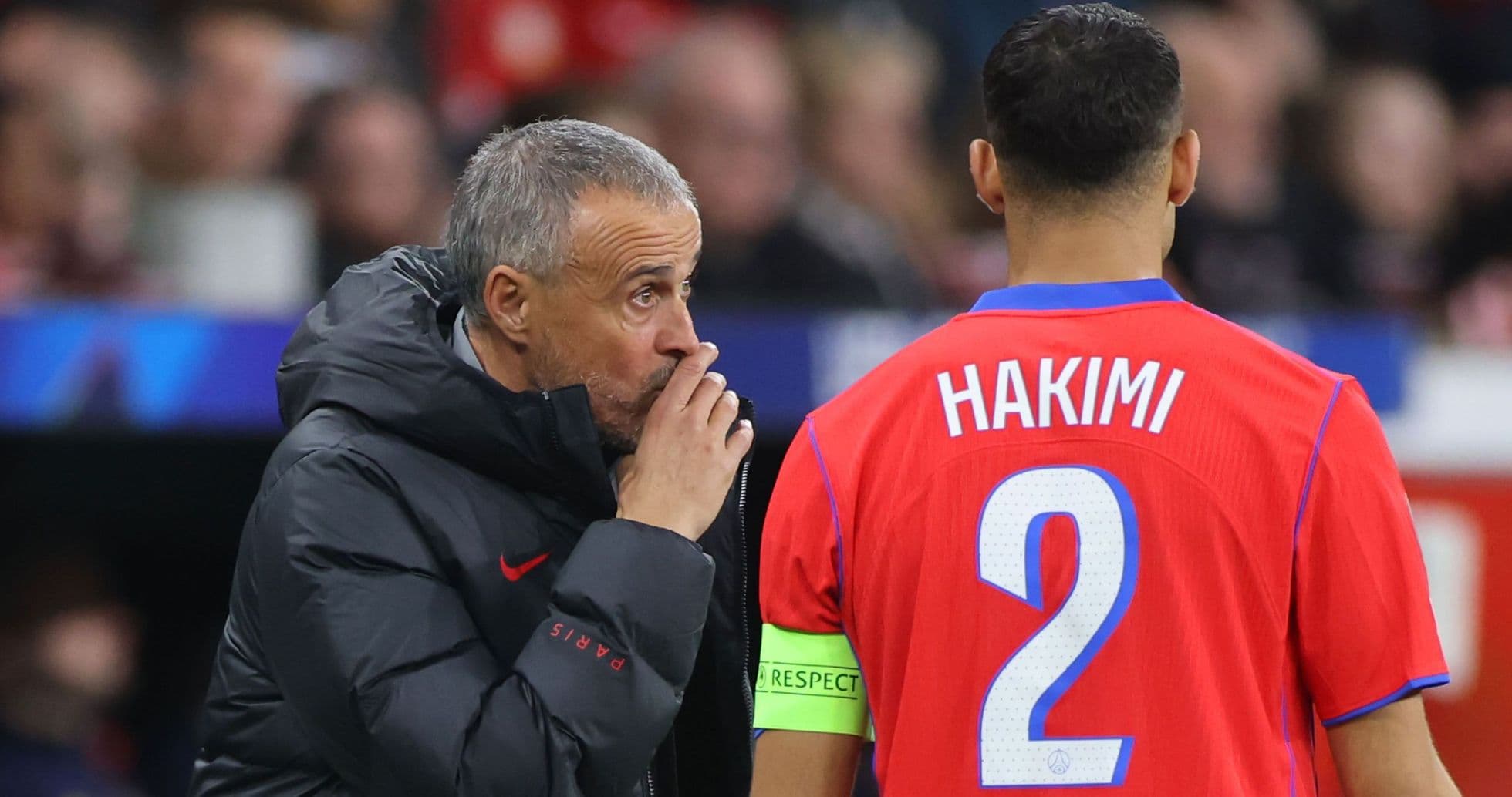 Coach speaking to player Hakimi during match