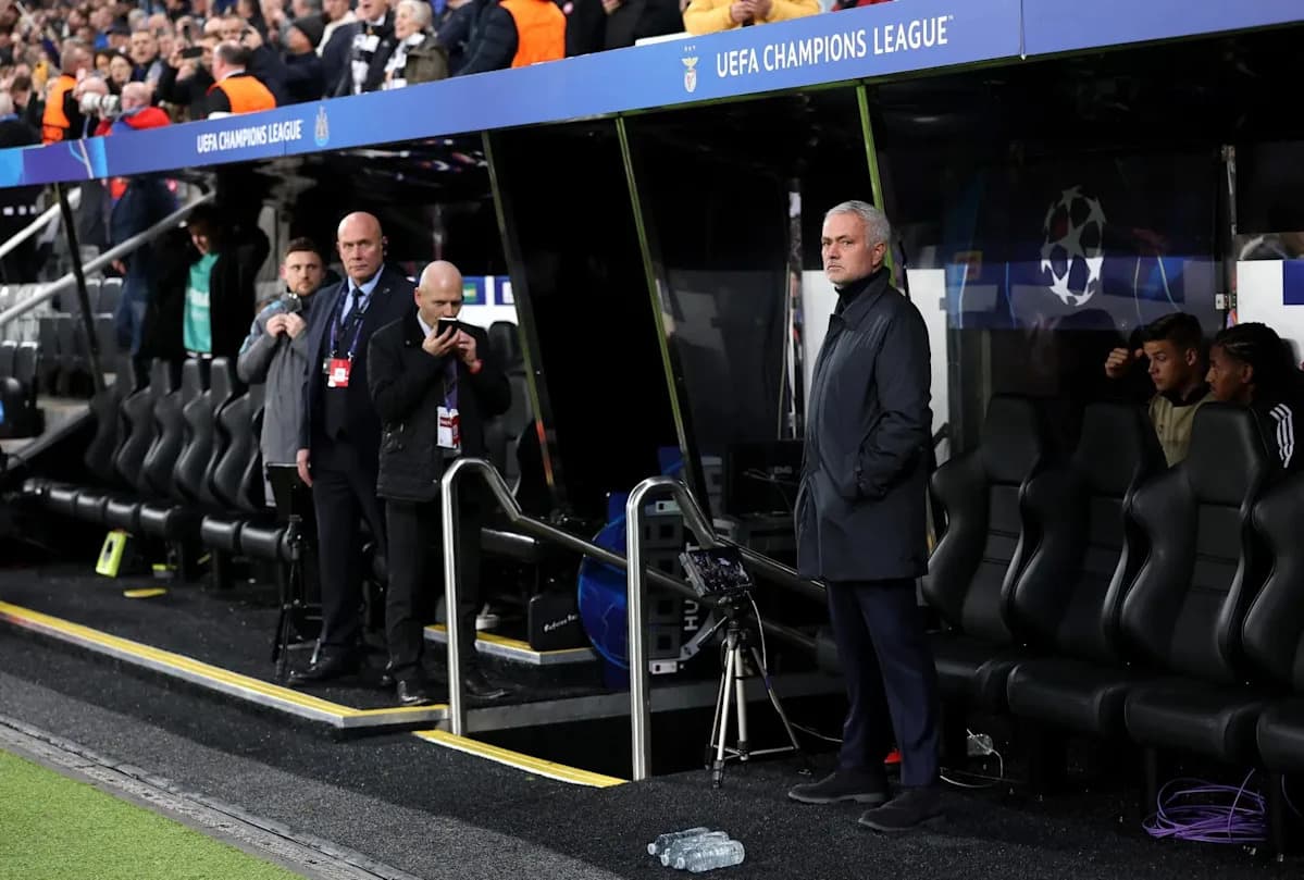 Manager observing match from the dugout during UEFA Champions League