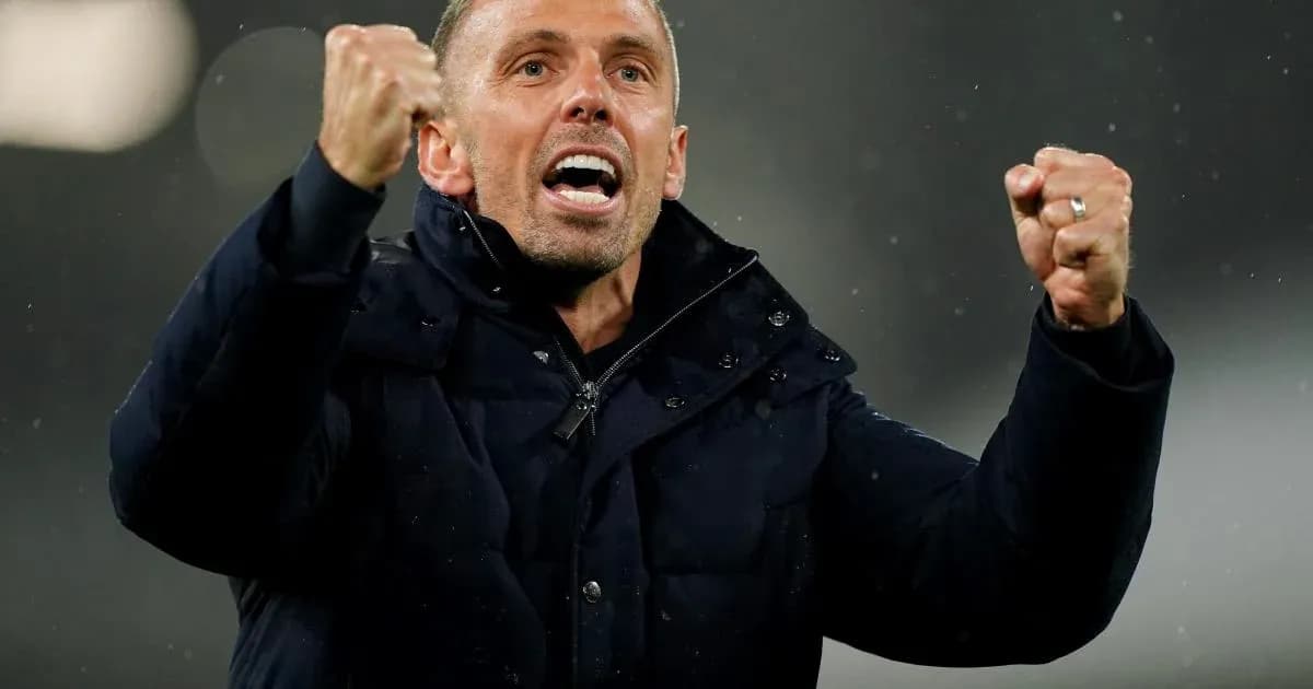 Coach celebrating with clenched fists during match