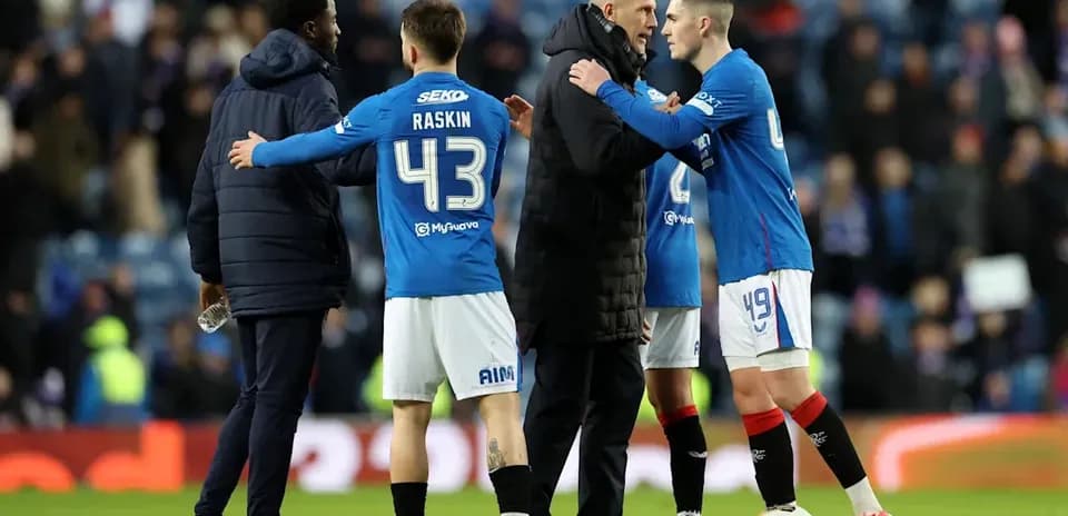 Players and coach discussing after a match