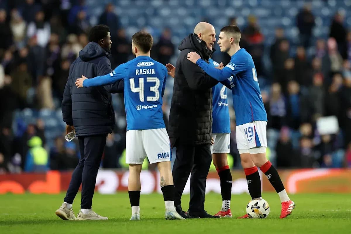 Players and coach discussing after a match