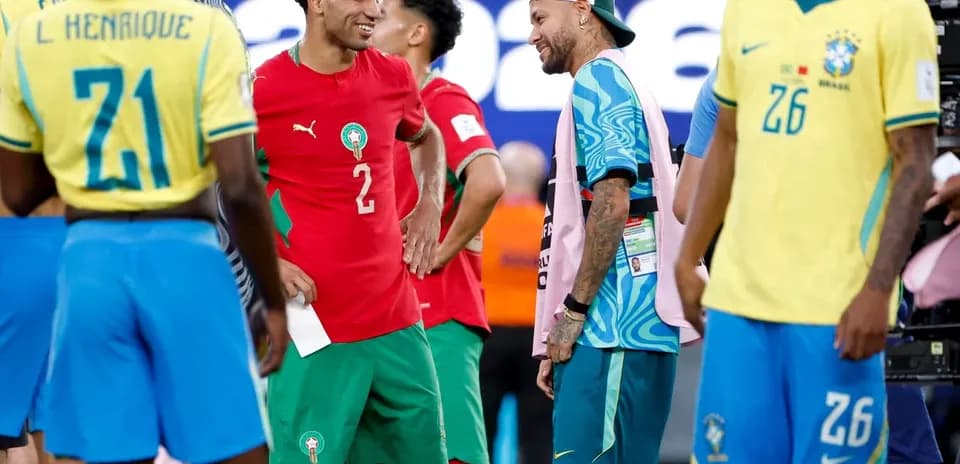 Players from Morocco and Brazil interacting post-match
