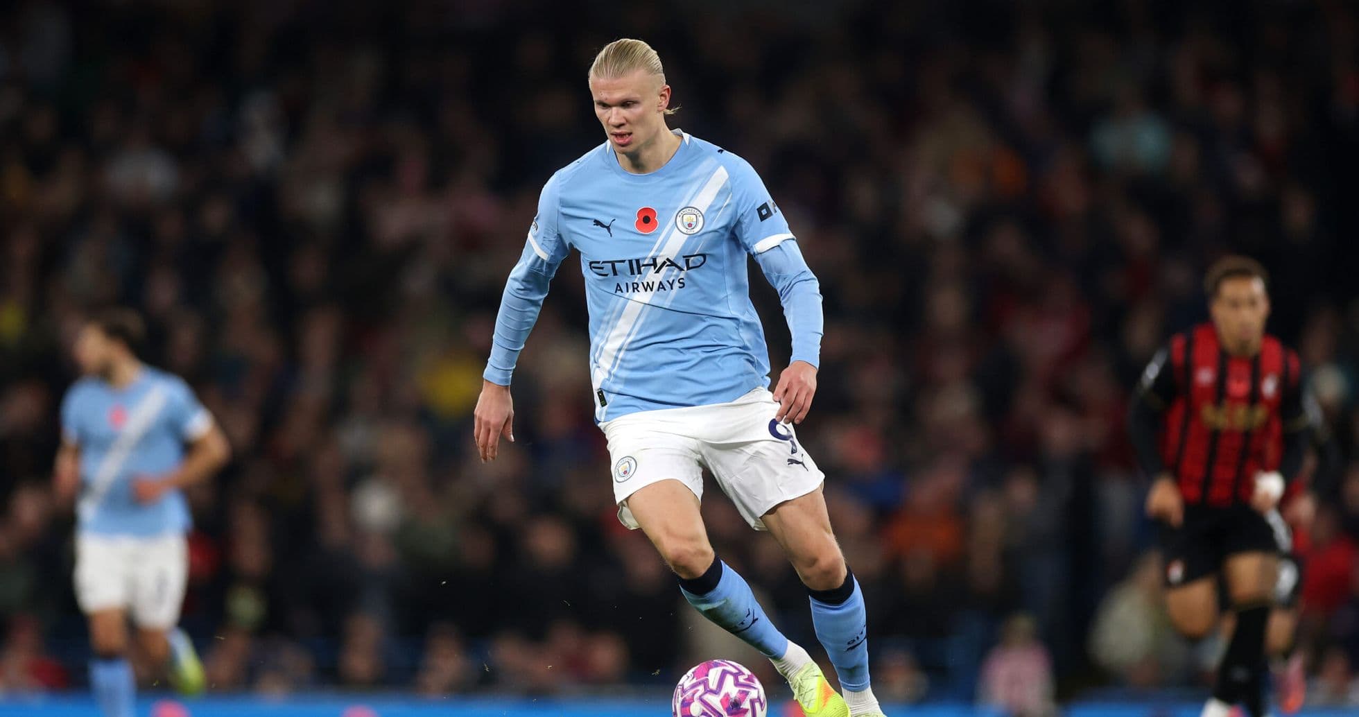 Manchester City player dribbling against Bournemouth