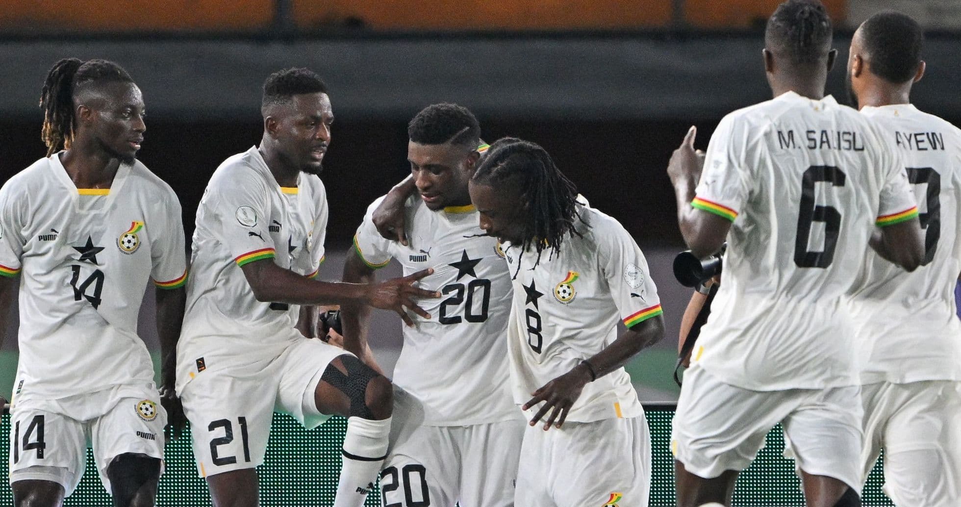 Ghana players celebrating a goal during a match