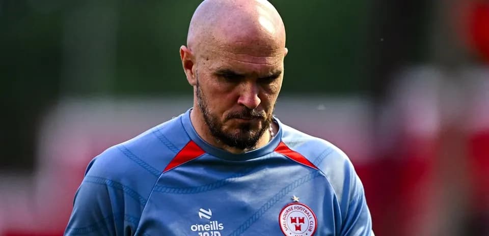 Player walking off the pitch in training attire