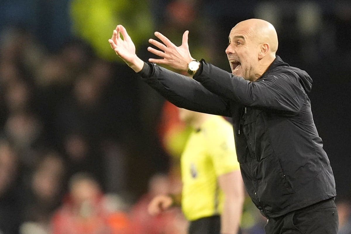 Manager gesturing during a match from the sidelines
