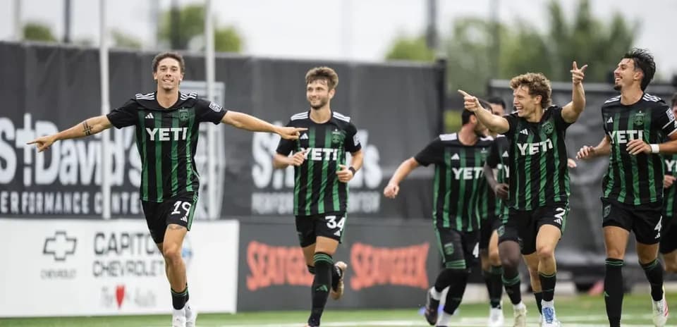 Austin II players celebrating a goal