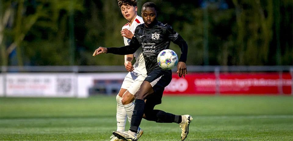 Player dribbling the ball during football match