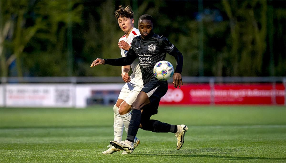 Player dribbling the ball during football match