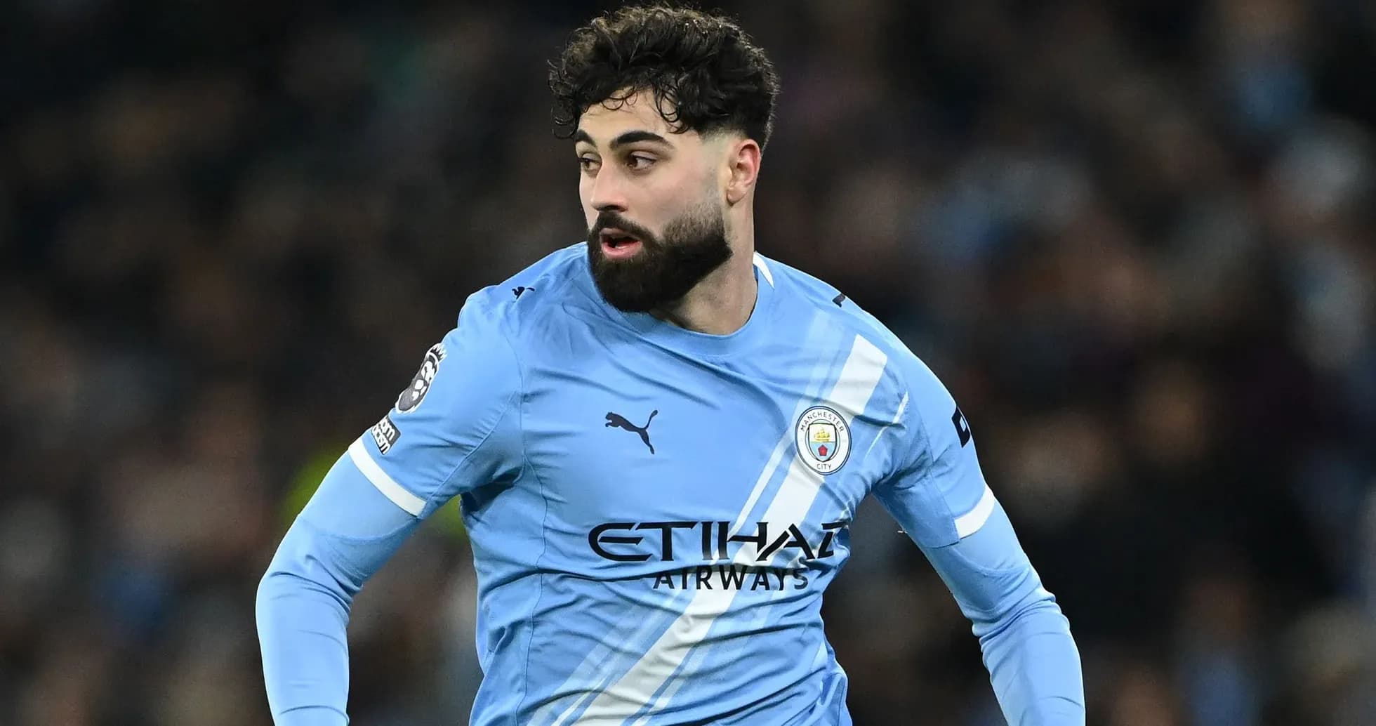 Player in Manchester City kit during match action