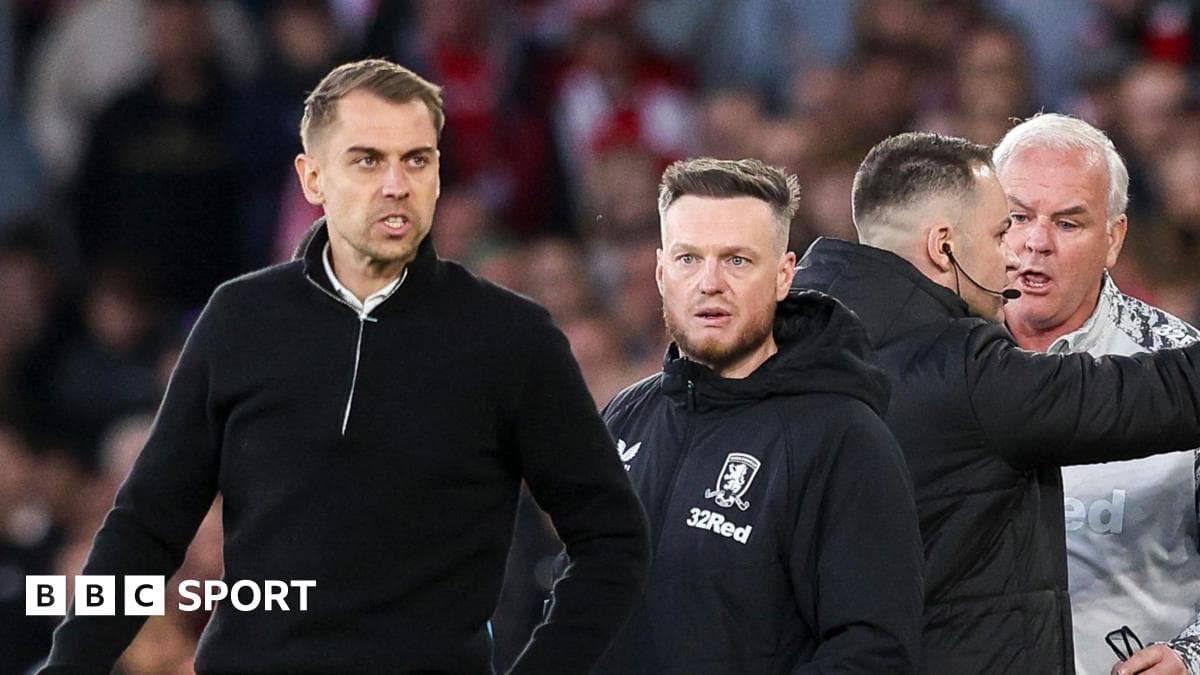 Coaches interacting during a football match
