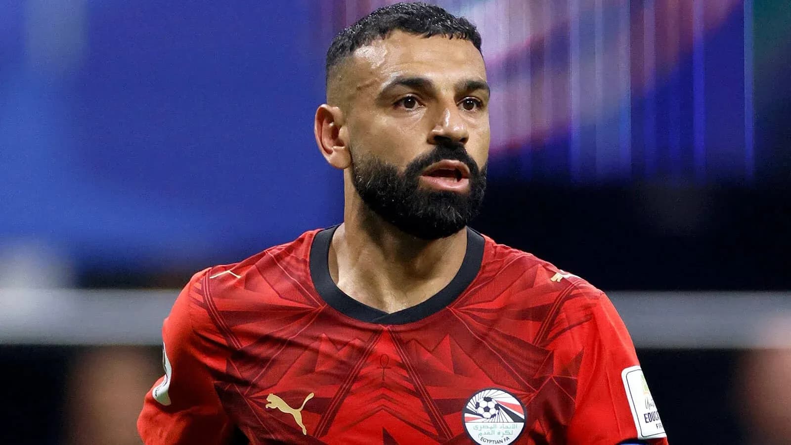 Player in red jersey during football match