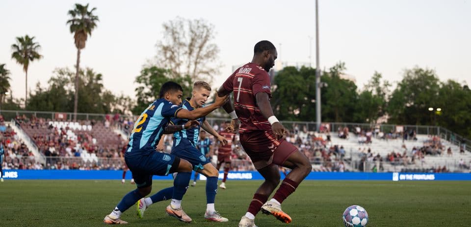 Players competing for the ball during match