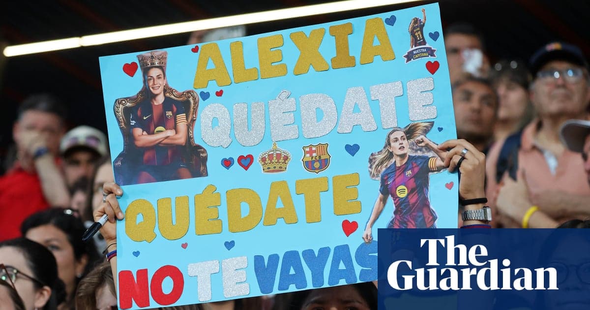 Fan holding sign for Alexia at football match