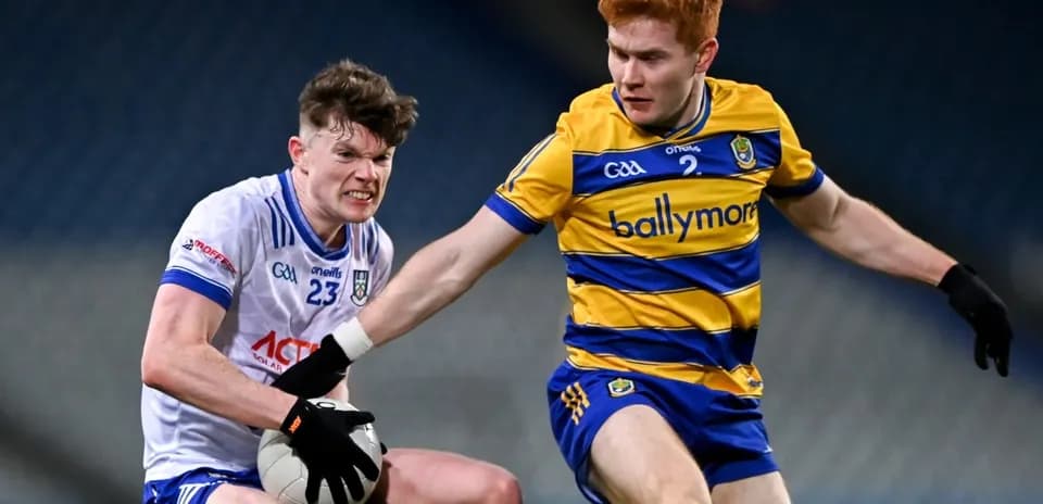 Two players contesting for the ball in Gaelic football