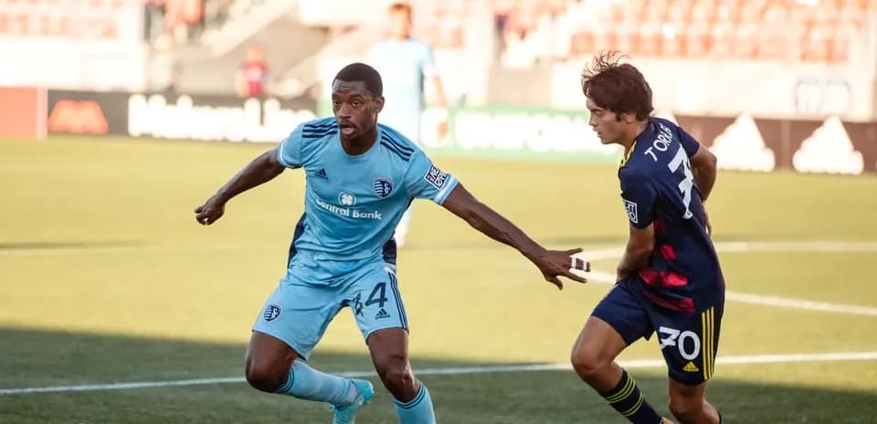 Players competing for the ball in MLS Next Pro