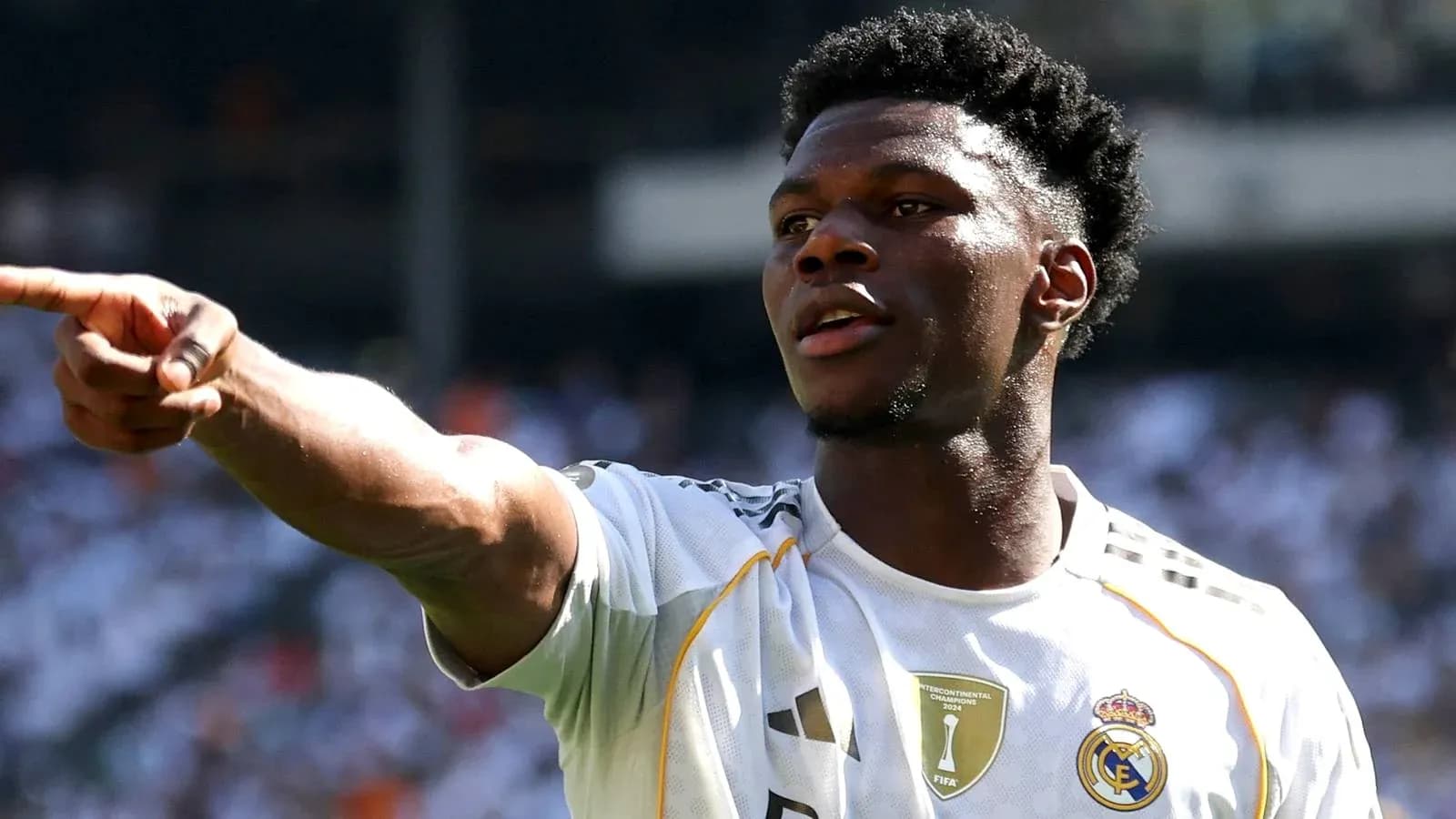 Player gesturing during a match with Real Madrid