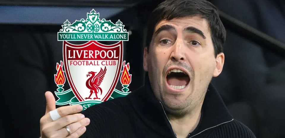 Person passionately gesturing near Liverpool FC logo