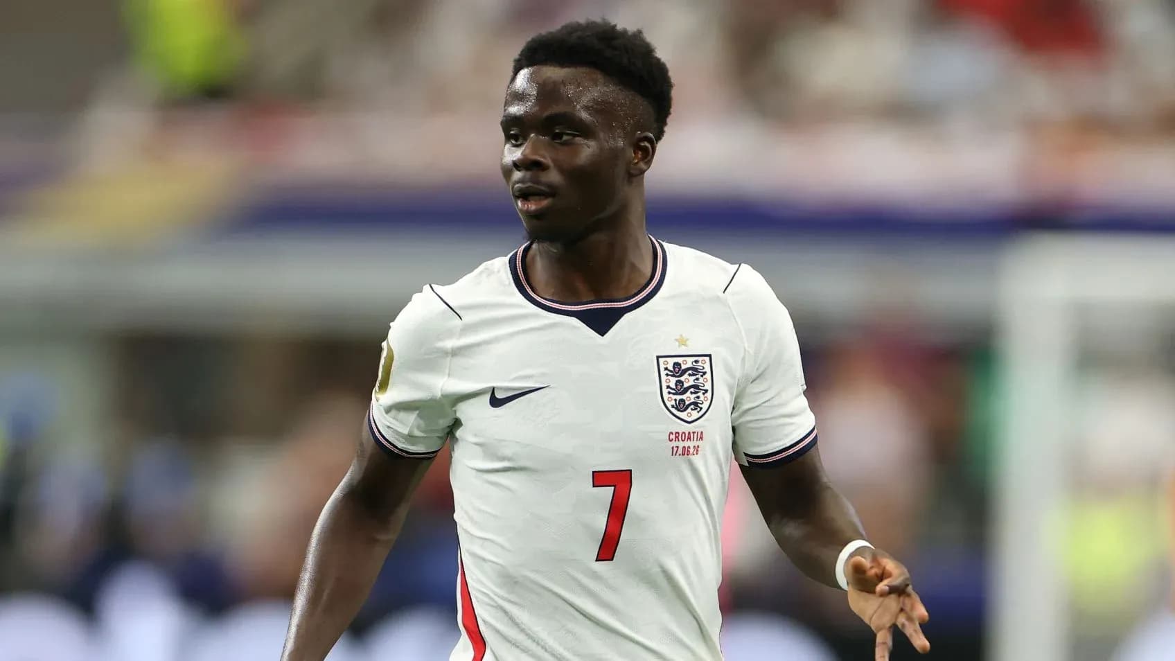 Player wearing England kit during match action