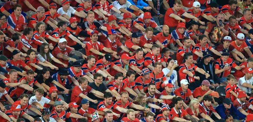 Crowd of fans in red shirts at event
