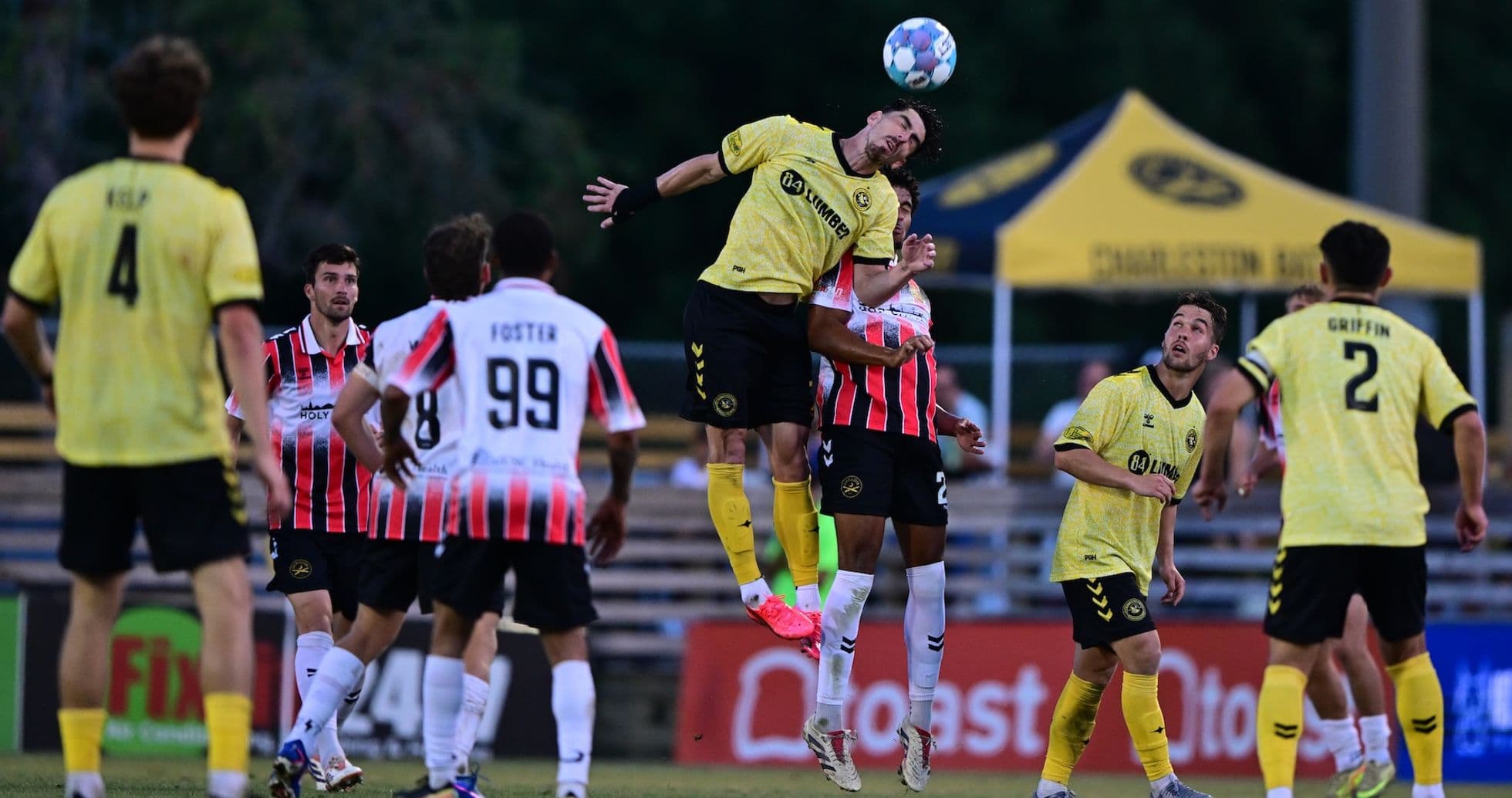 Player jumping for header during Charleston Battery match
