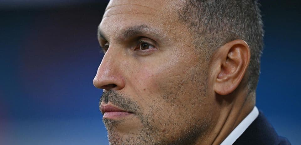Close-up of a man in profile, serious expression