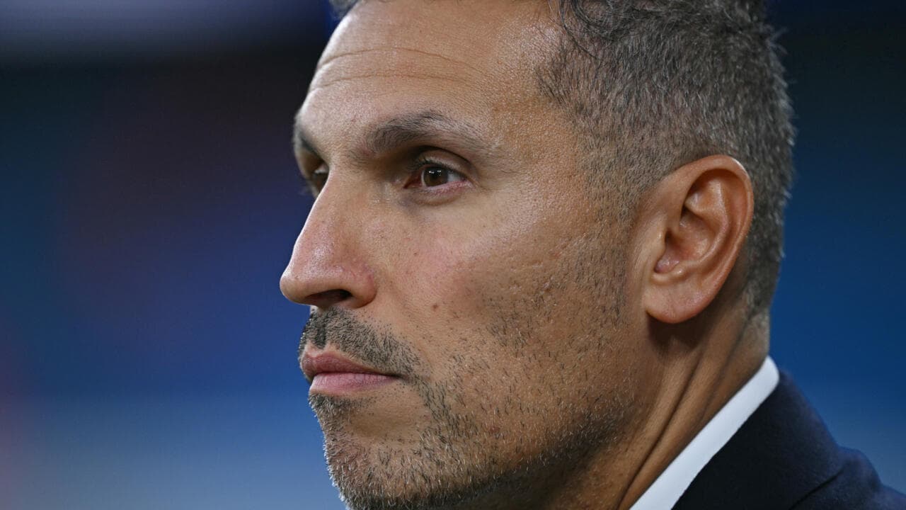 Close-up of a man in profile, serious expression