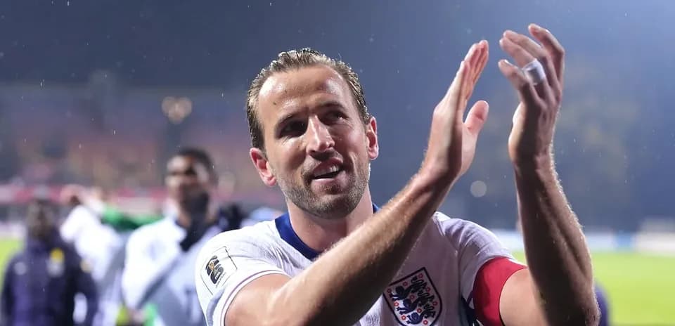 Player applauding fans after a match