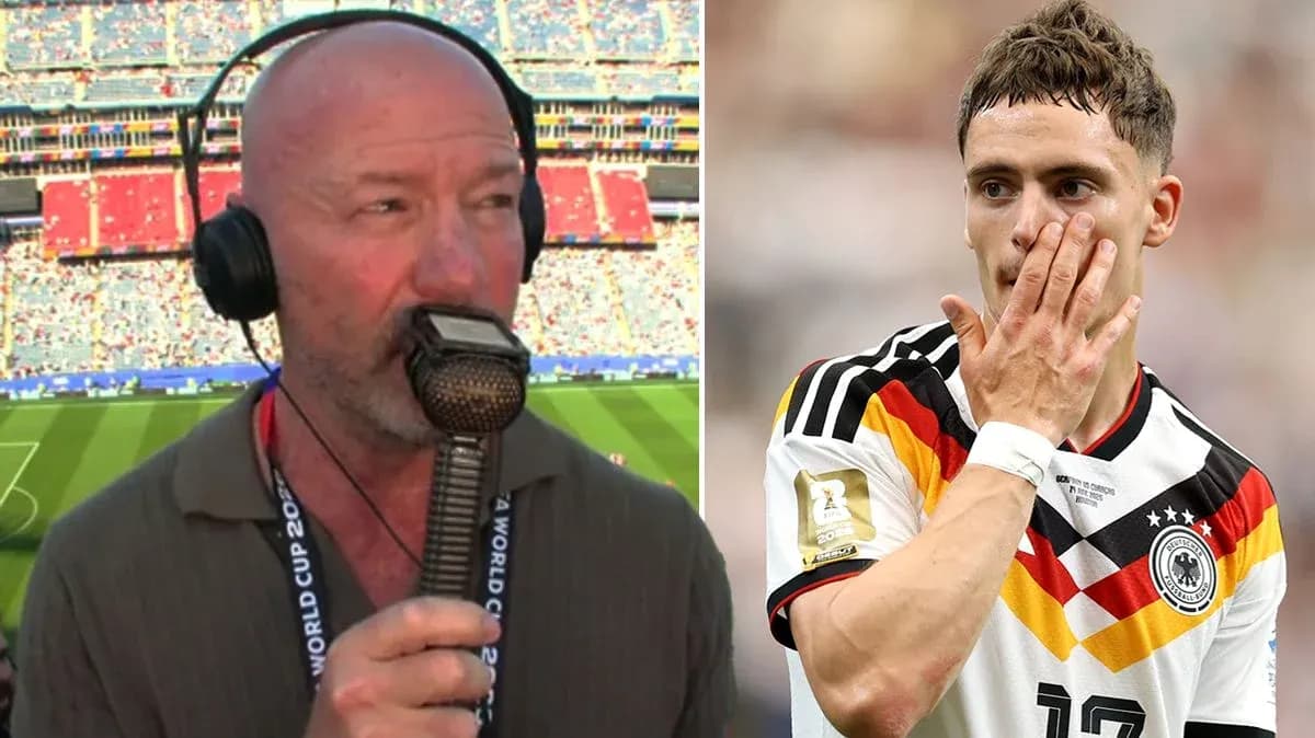 Commentator speaking with microphone, player in Germany jersey