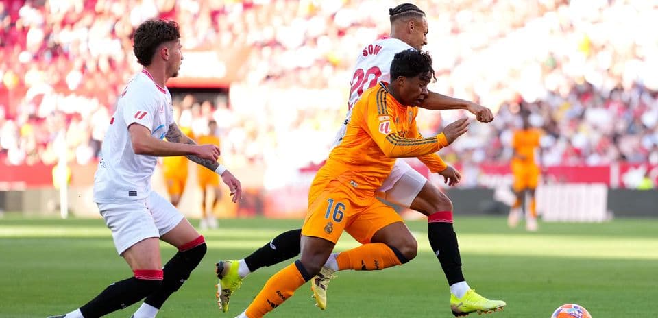 Sevilla and Real Madrid players in action