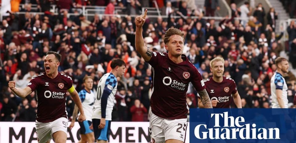 Hearts player celebrating a goal with fans