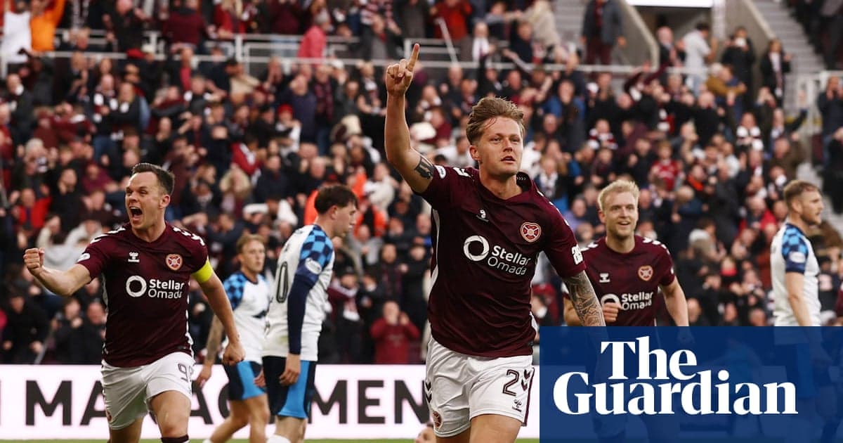 Hearts player celebrating a goal with fans