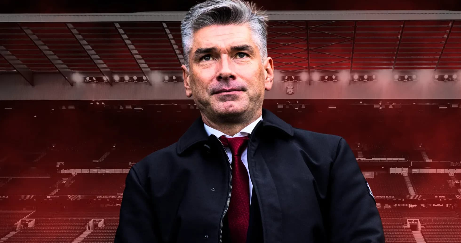 Coach standing in front of stadium backdrop