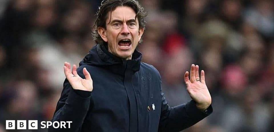 Manager gesturing during match from the sideline