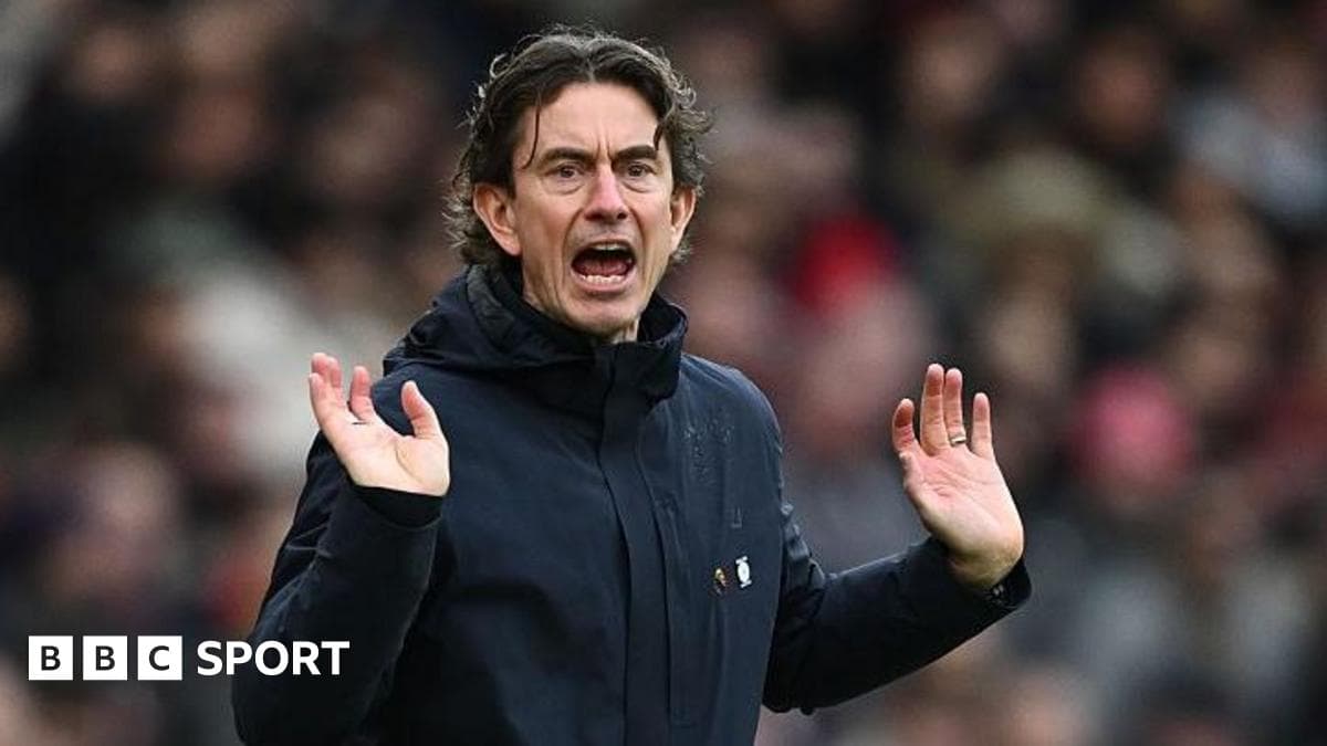 Manager gesturing during match from the sideline