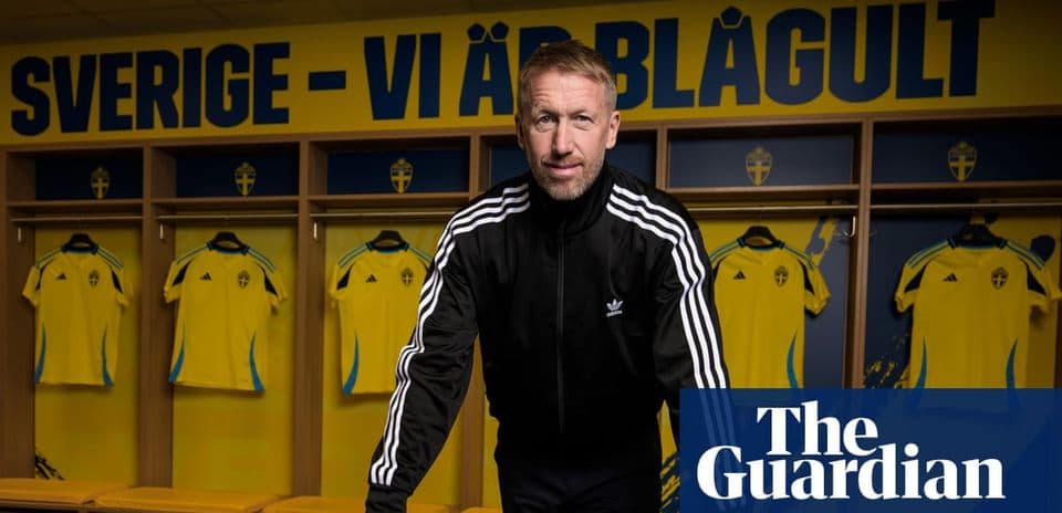 Coach standing in front of Swedish team jerseys