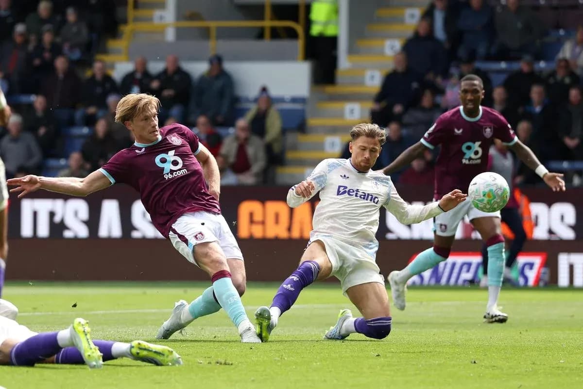Player sliding tackle during Burnley vs Aston Villa match