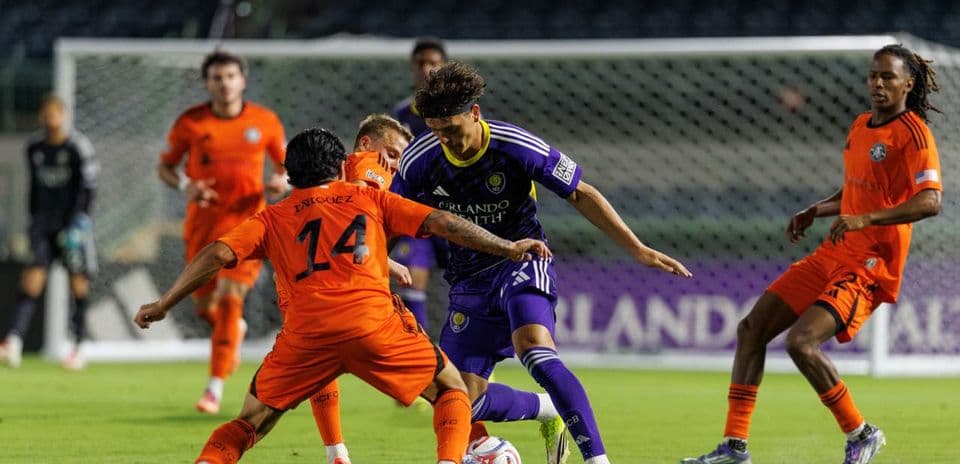Players competing for the ball during match