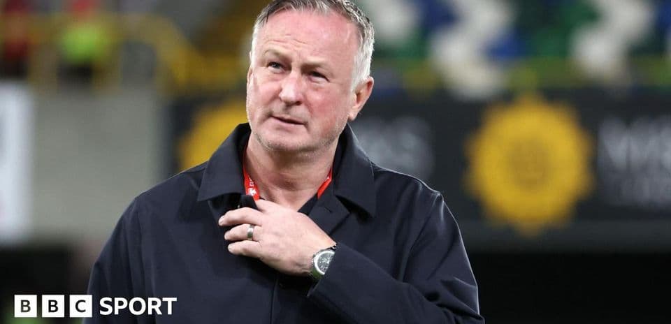Manager on pitch during match preparations