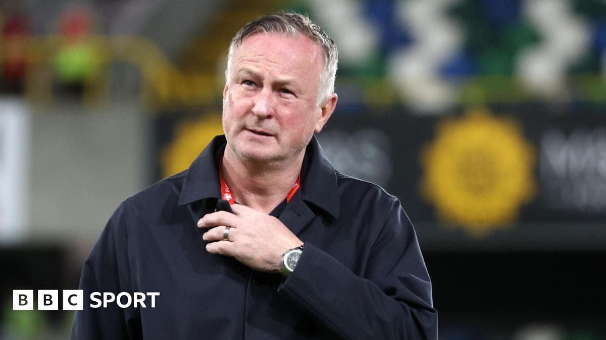 Manager on pitch during match preparations