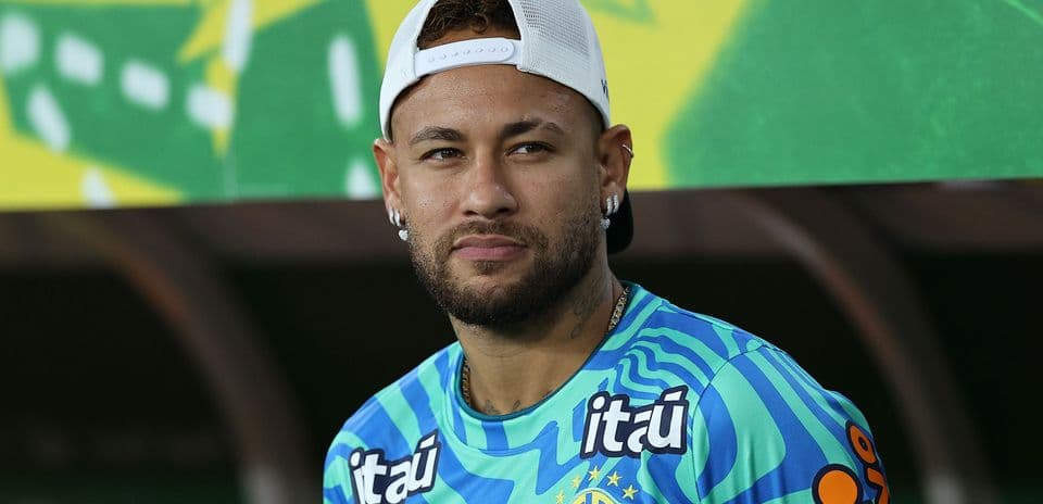 Player wearing Brazil jersey at press conference