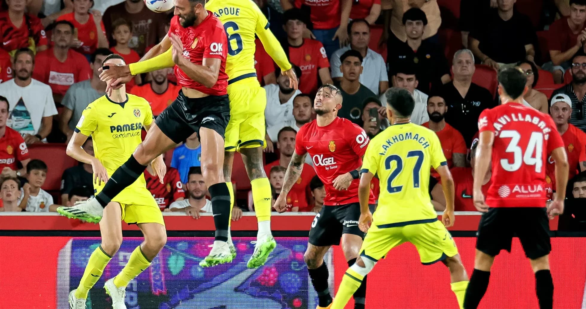 Players competing for the ball during Mallorca match