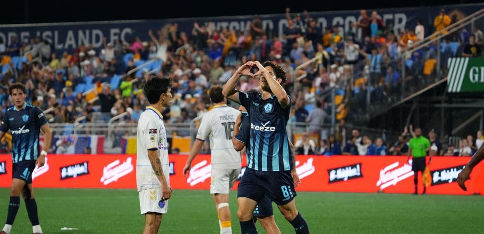 Player celebrating after scoring in USL match