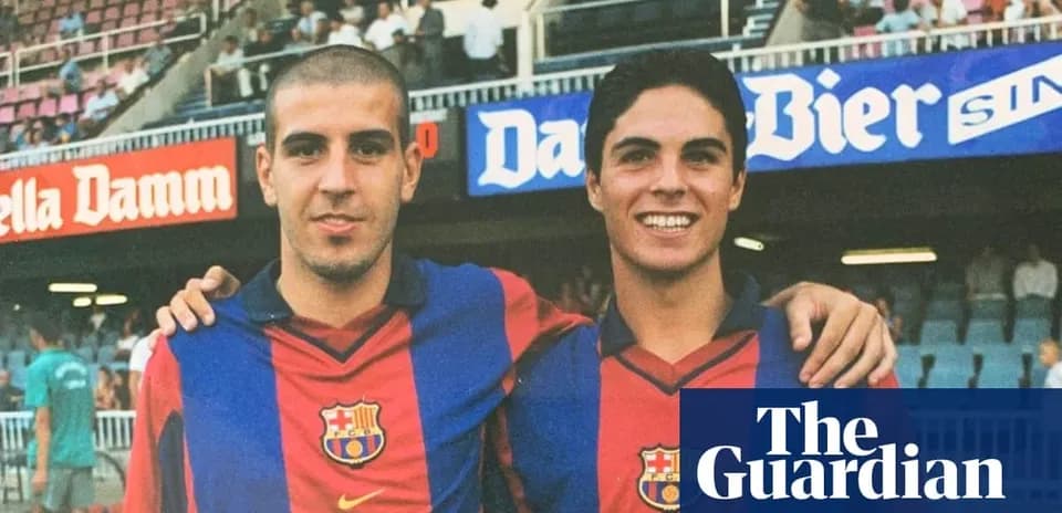 Two young players posing in Barcelona jerseys