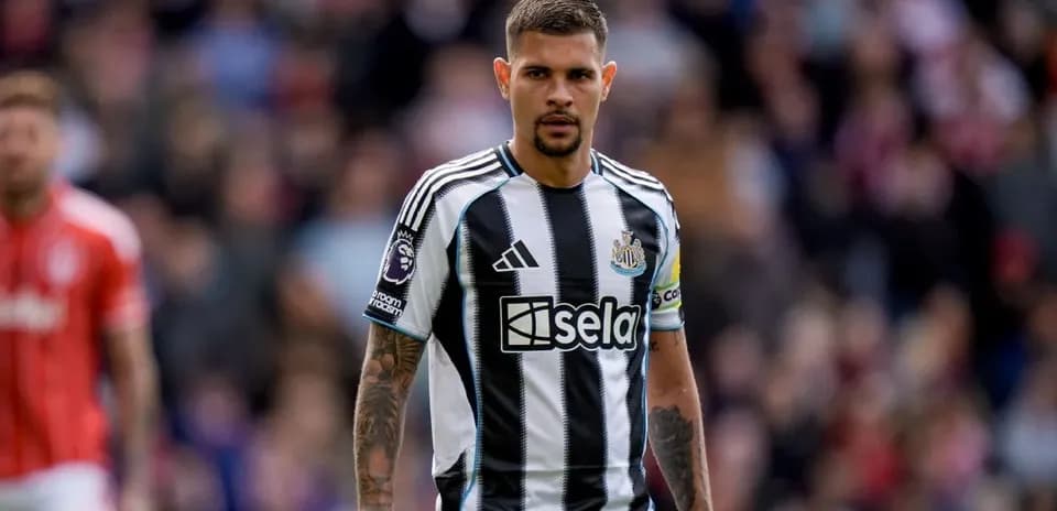 Newcastle player standing on the pitch during match